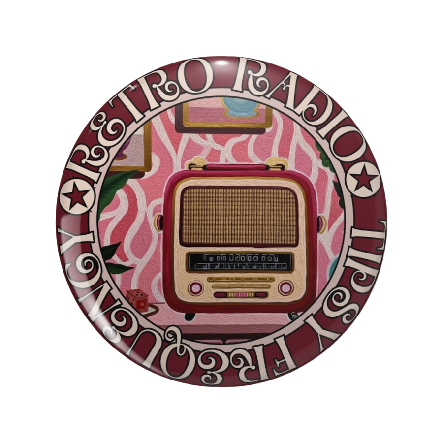 An ornate round pinback button close up, containing an illustration of a burgundy and gold vintage radio.