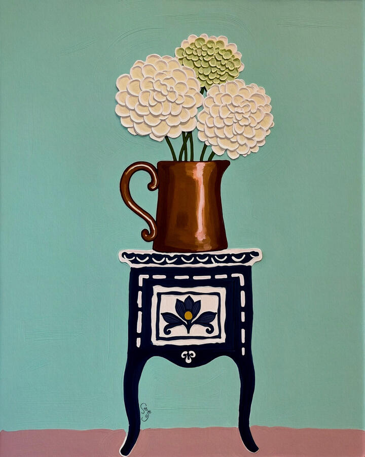 Thick impasto Cream hydrangea flowers in a brushed bronze jar sitting atop a white patterned dark navy vintage inlaid cabinet. Dusty aqua green background.