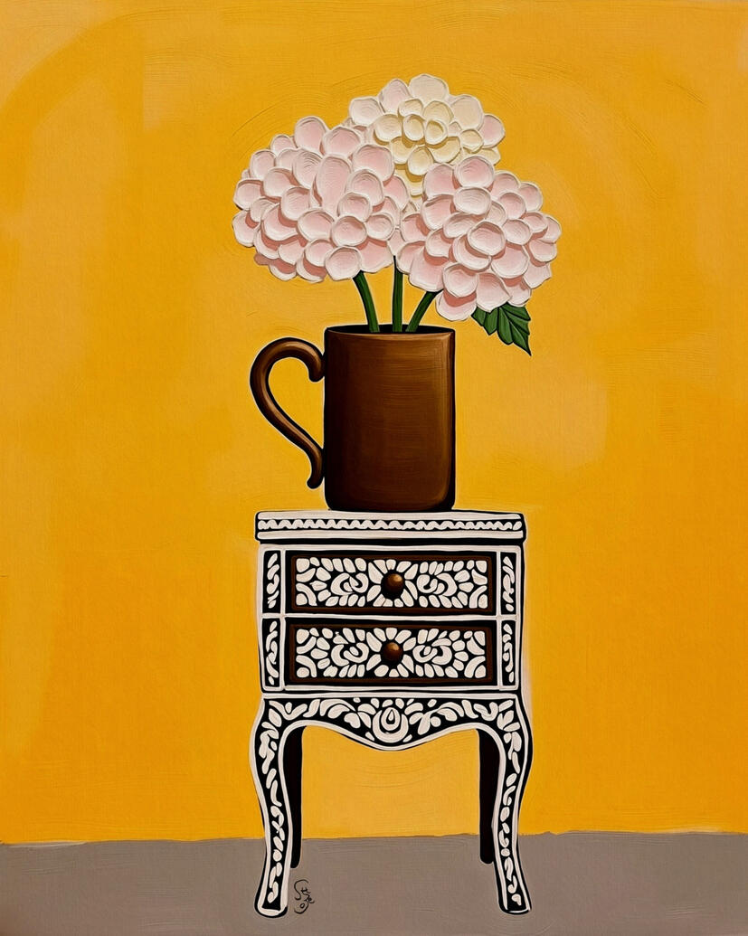 Soft pink flowers in a brown cup sitting atop a black and white patterned inlaid cabinet. Bright yellow background.