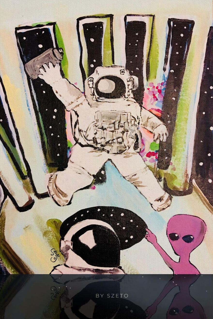 A hand-drawn space scene with an astronaut floating among black starry shapes, while a small purple pink alien pointing finger at the astronaut.