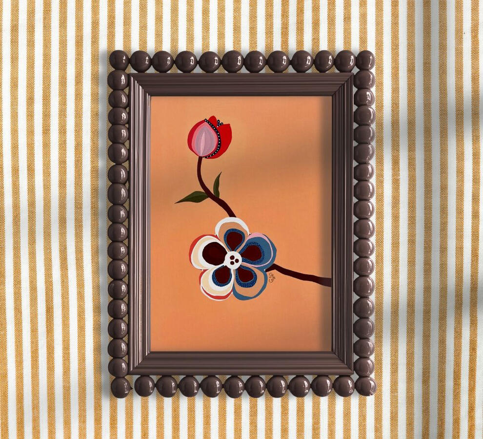 A matt metallic green vintage picture frame on white wall, containing an illustration of A vintage-style illustrated card titled “Test,” showing a duck-like robot and a pink parrot before a medieval castle. The duck is holding a set of keys in his hand.