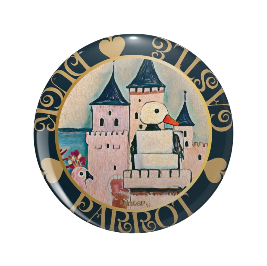 An ornate round pinback button close up, containing an illustration of A vintage-style illustrated card titled “Winter,” showing a duck-like robot and a pink parrot before a medieval castle.