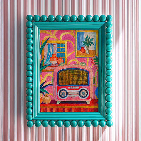 Framed mockup of a shocking pink retro radio artwork displayed inside a glossy pink frame against a striped pink background. Kokomo FM art poster on a shocking pink bacground, featuring saturated colors and a 1960s psychedelic tropical vibe.