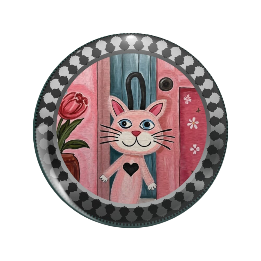 An ornate round pinback button close up, containing an illustration of a pink cat against a striped pink background. The cat has a mischievous and inviting expression on its face, and a black heart on its chest.
